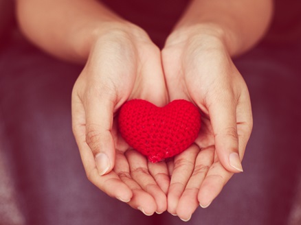hands holding red heart